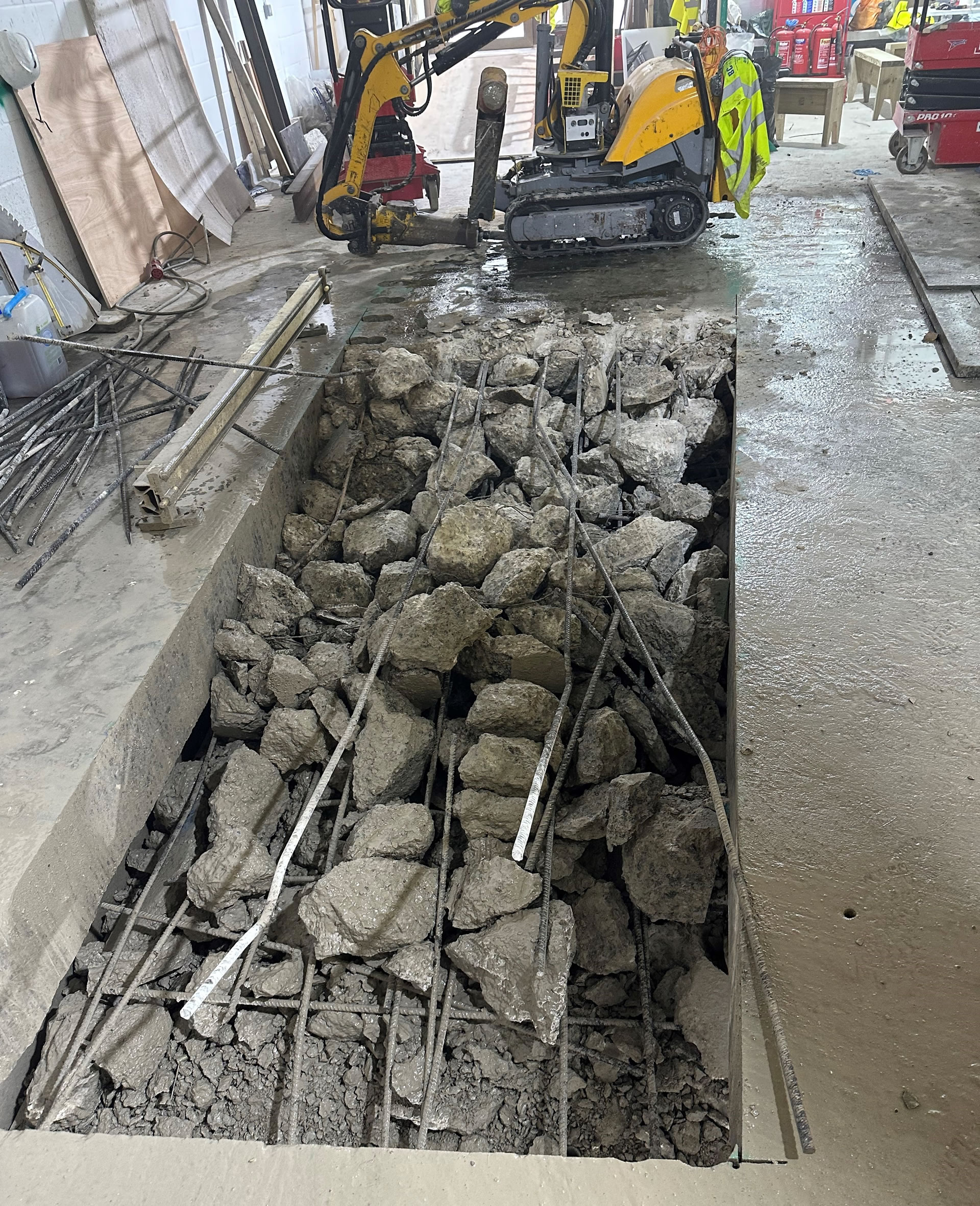Below you can see the Brokk machine used to cut the  lower opening on ground floor.