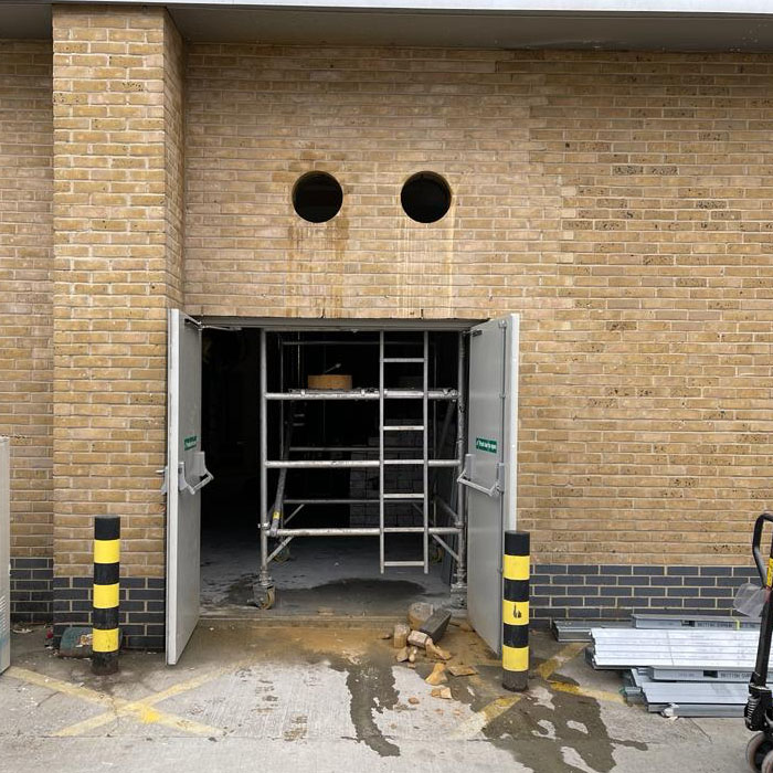 two core drilled holes above emergency escape inn london warehouse